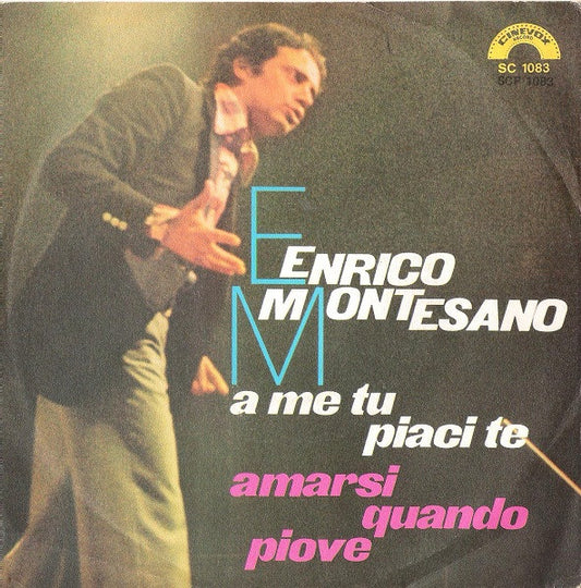 Enrico Montesano : A Me Tu Piaci Te / Amarsi Quando Piove (7")